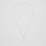 top view of romantic sterling silver chain necklace featuring two larger heart pendants and various small hearts throughout chain